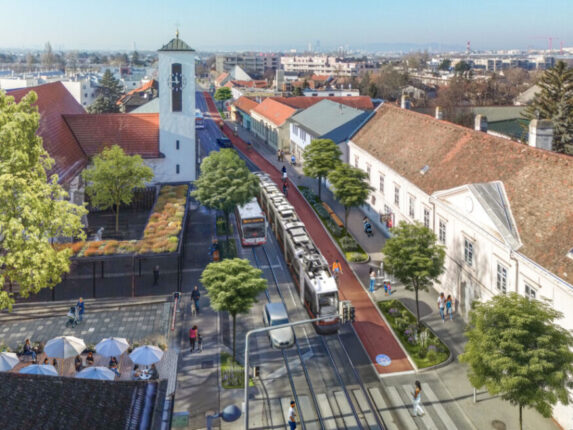 Essling: Die Esslinger Hauptstraße als 30er Zone mit Straßenbahn, Radweg und flanierenden Fußgänger:innen